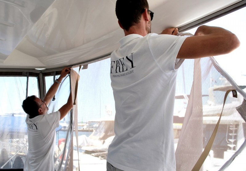 Team Frey installing new functional sunshades on flybridge of Prestige 500. High quality sun protection with easy open access.