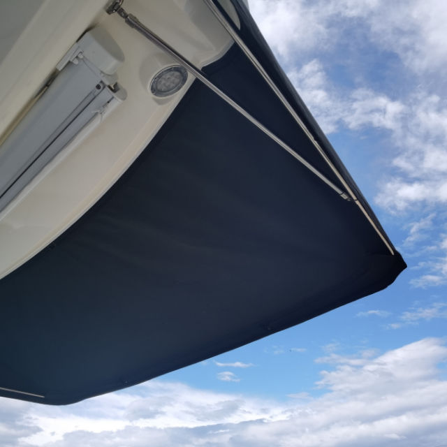 Cockpit awning Prestige 460s in Sunbrella Plus black. Waterproof, abrasion & mould resistant for summer & winter protection. 