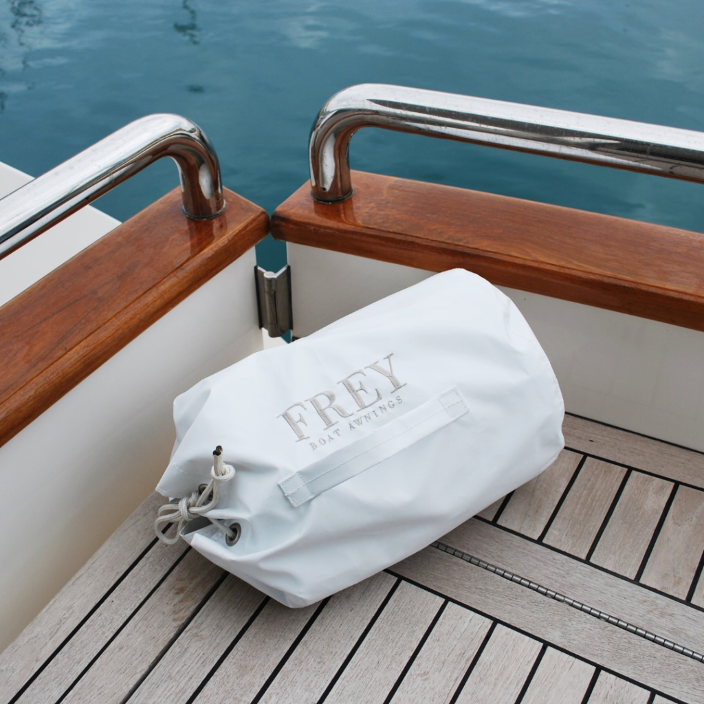 Frey Smart Storage Bag with embroidered logo on deck of Horizon Elegance 78ft yacht at sea.