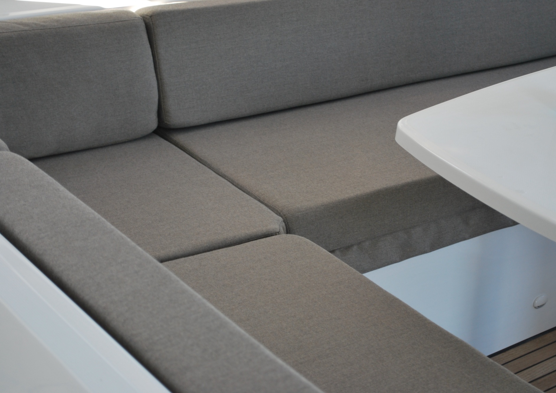 Straight lines & shape of grey yacht cushions in 10cm dryfast foam give elegance & comfort to the aft cockpit of the Lagoon.