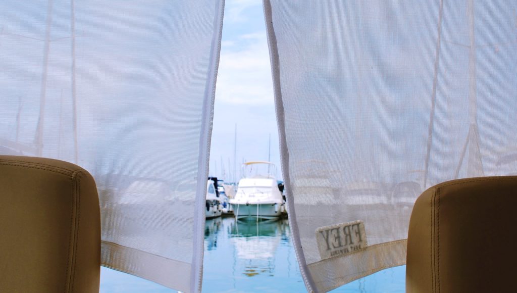 Sun protection in summer a 'must have' with UV protection yacht sunshades for shade and privacy on your yacht.