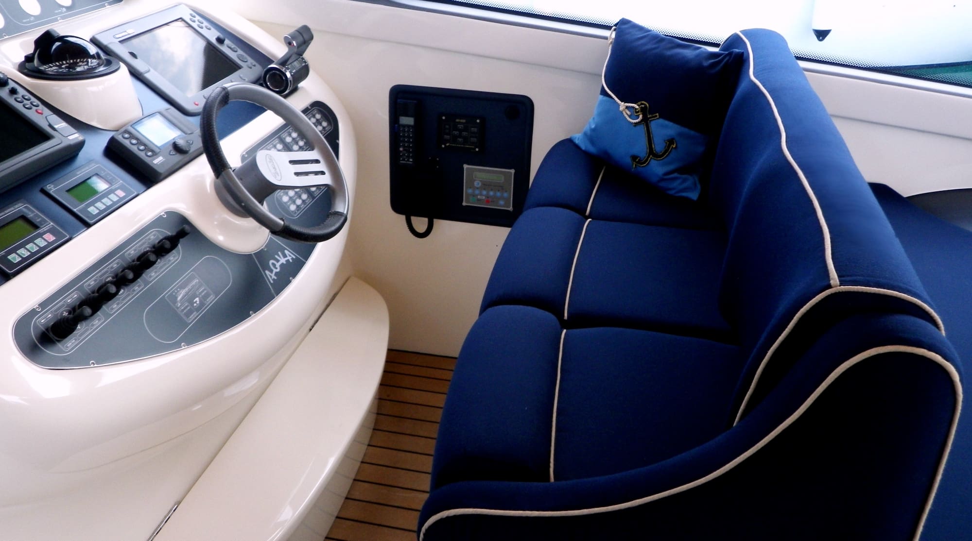 Royal blue colour yacht cushions with white piping highlighting the shape of the cushions for a luxurious look.