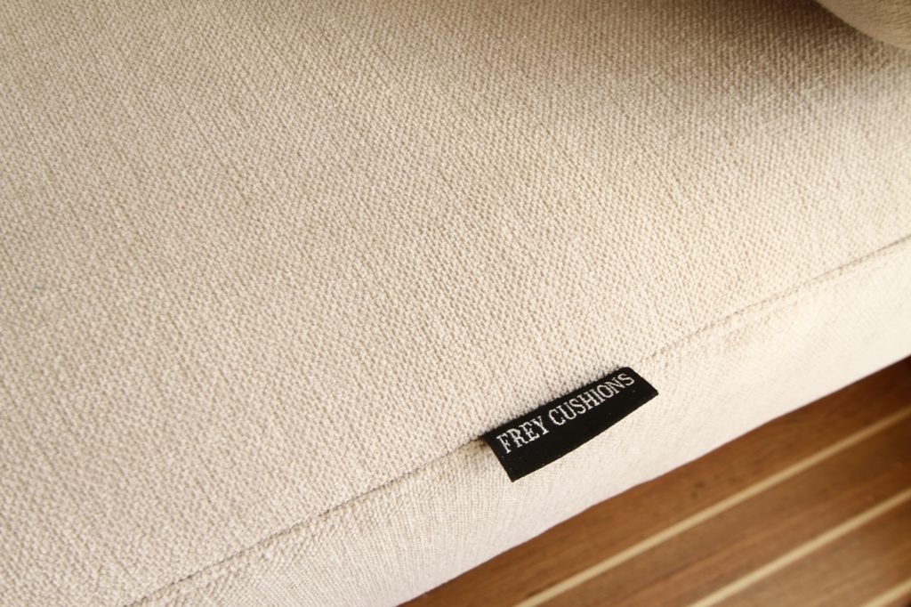 Soft neutral textile tones from Sunbrella Cushion range for yacht interior upholstery, perfectly match teak wood interiors.