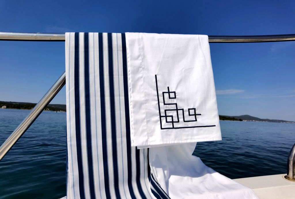 Pure and soft, natural cotton sheets or light-weight satin sheets will both keep you cool while sailing during the summer.