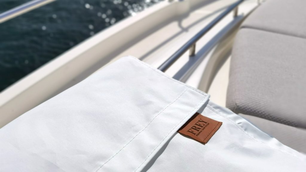 Space saving, Frey Smart Storage Bag in white colour, is a practical solution for storing yacht sunshades when not in use.