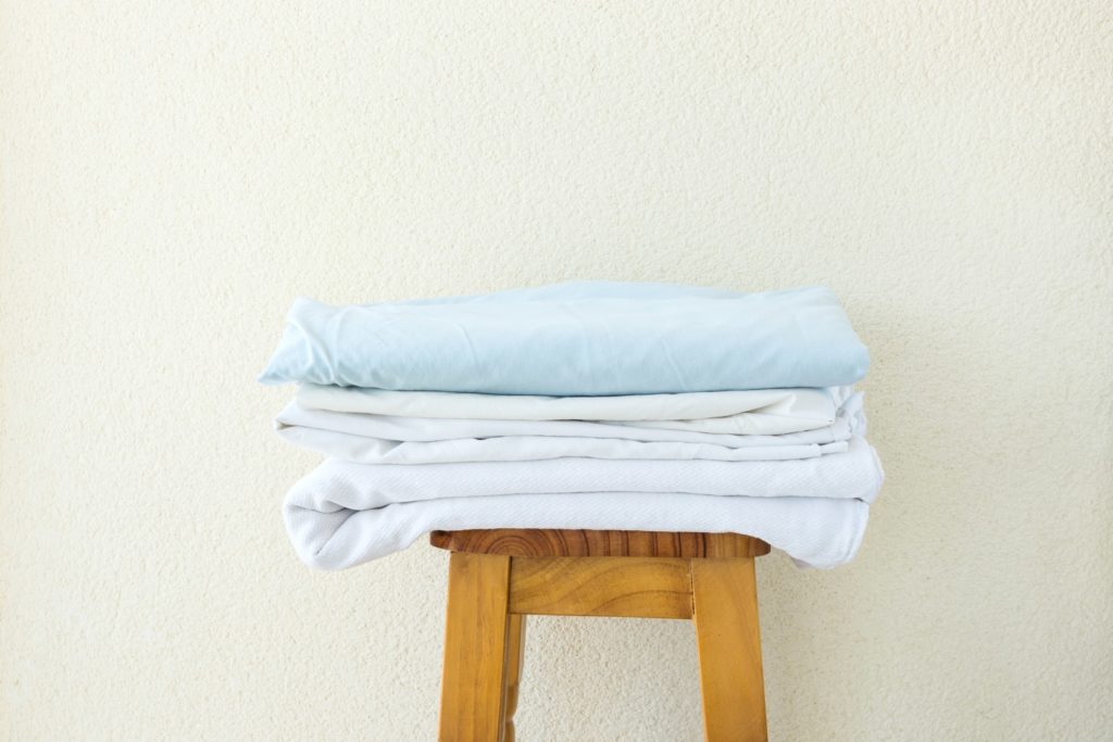 Pure and soft, natural cotton sheets or light-weight satin sheet sets will both keep you cool while sailing during the summer.