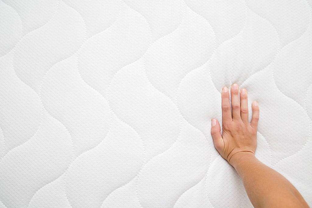 Hand touching additional, extra comfort, protective layer, for bespoke anti-allergic yacht mattress.
