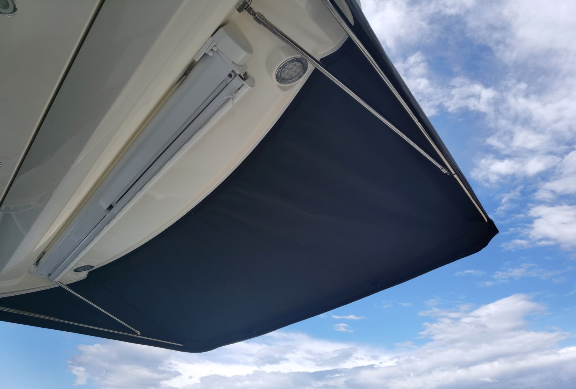 Sunbrella Plus marine fabric for cockpit awning on Prestige 460S. Durable fabric with properties for all weather conditions.