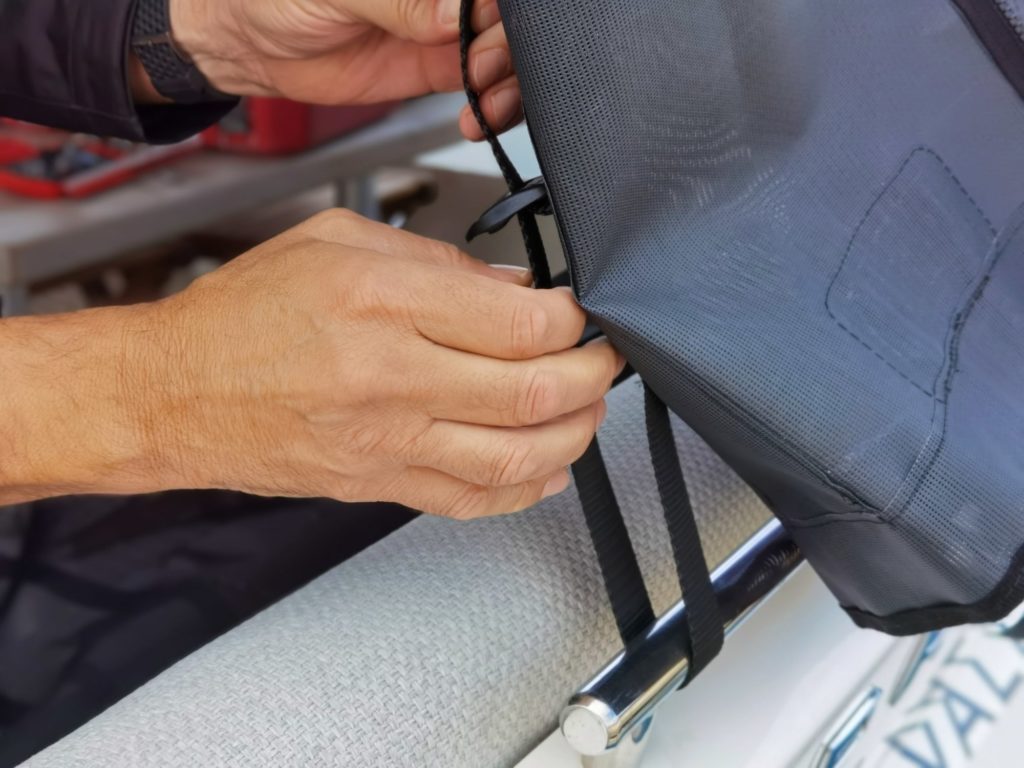 Black cockpit sunshades easy to install and adjusted with strong straps and buckles for extra strength on Prestige 460S yacht.