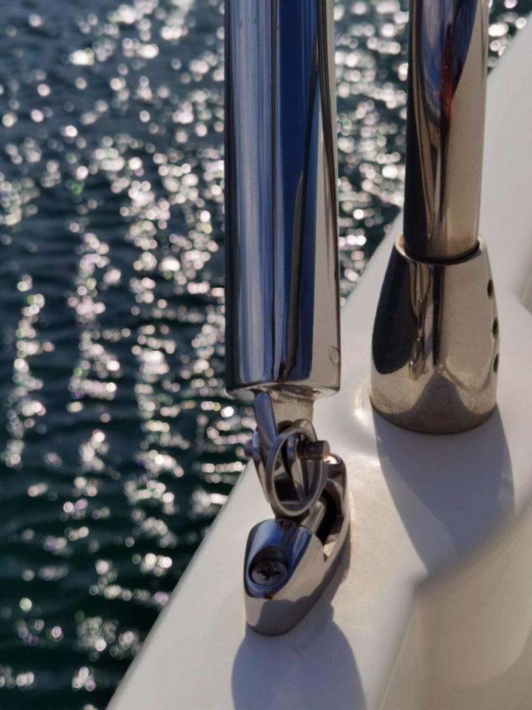 Tightly secured stainless steel brackets with adjustable tubes for custom sunshades over sundeck of the Prestige 460S yacht.