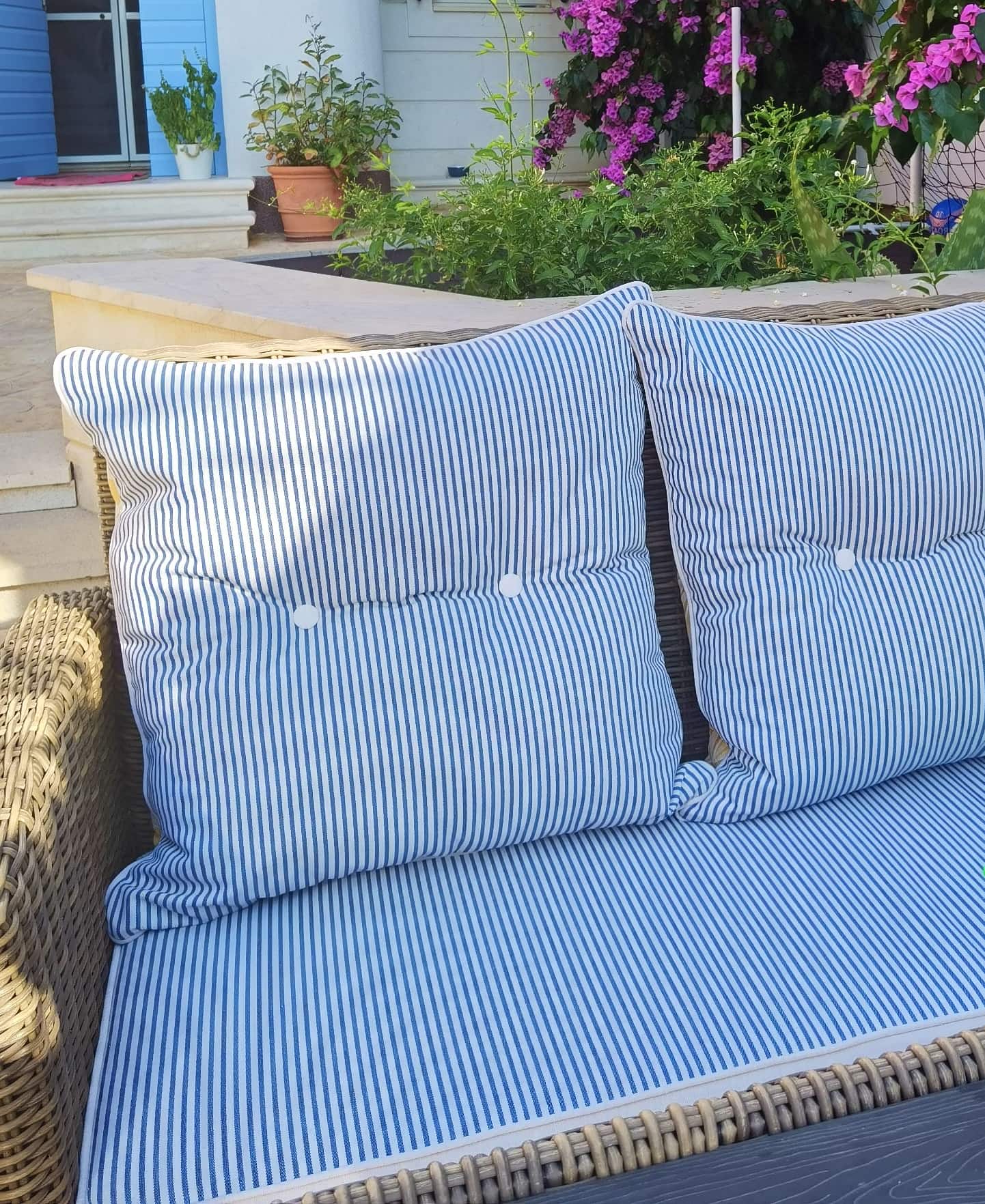 Frey outdoor garden cushions in blue white stripes with contrasting yellow palms. Incompatible motifs for perfect dual design.