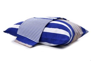 Cotton bed linen in nautical motifs such as thick and thin blue and white stripes are perfect for your yacht cabin interior.