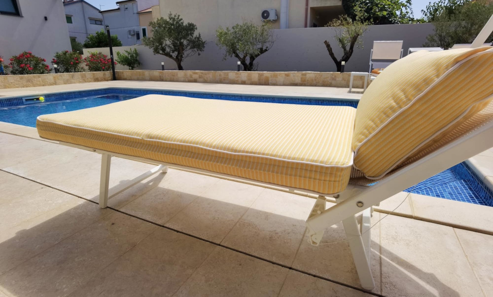 Cushions in vivid yellow & white stripes for white wooden deck chairs/loungers. Poolside comfort for Villa Stella guest house.