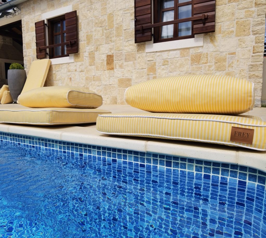 Custom design with dryfast foam, durable, fadeproof & water repellent soft yellow stripe cushions are ideal for poolside use. 