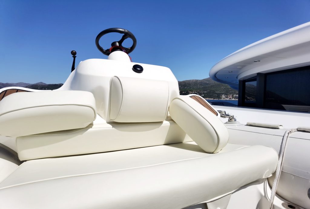 Superyacht tender exterior cushions, complete re-upholstery in ivory vinyl that is water resistant, durable and elegant.