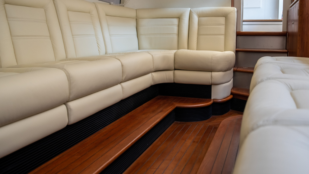 Vikal Hybrid limousine reupholstered seating by Frey in soft luxurious ivory leather beautifully offsets the teak flooring.