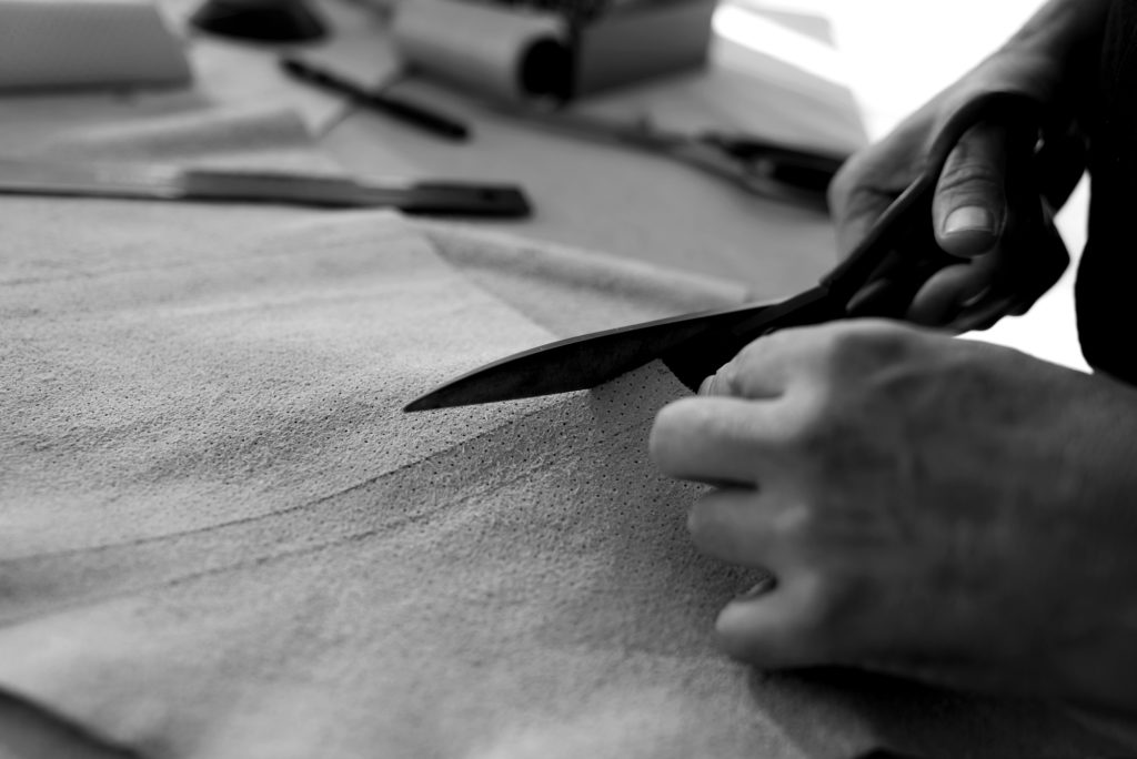 Hancrafting leather with care and dedication to detail for authentic custom-made upholstery, tailored to your yacht needs.