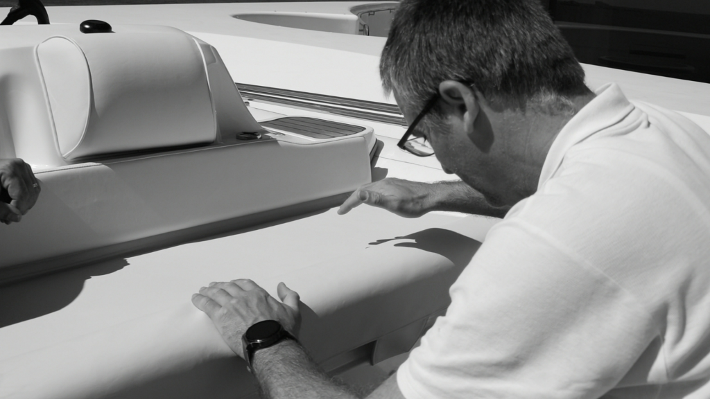 Team Frey member carefully installs new refit cushions for main console seating area of Williams jet tender on M/Y Al Mirqab.